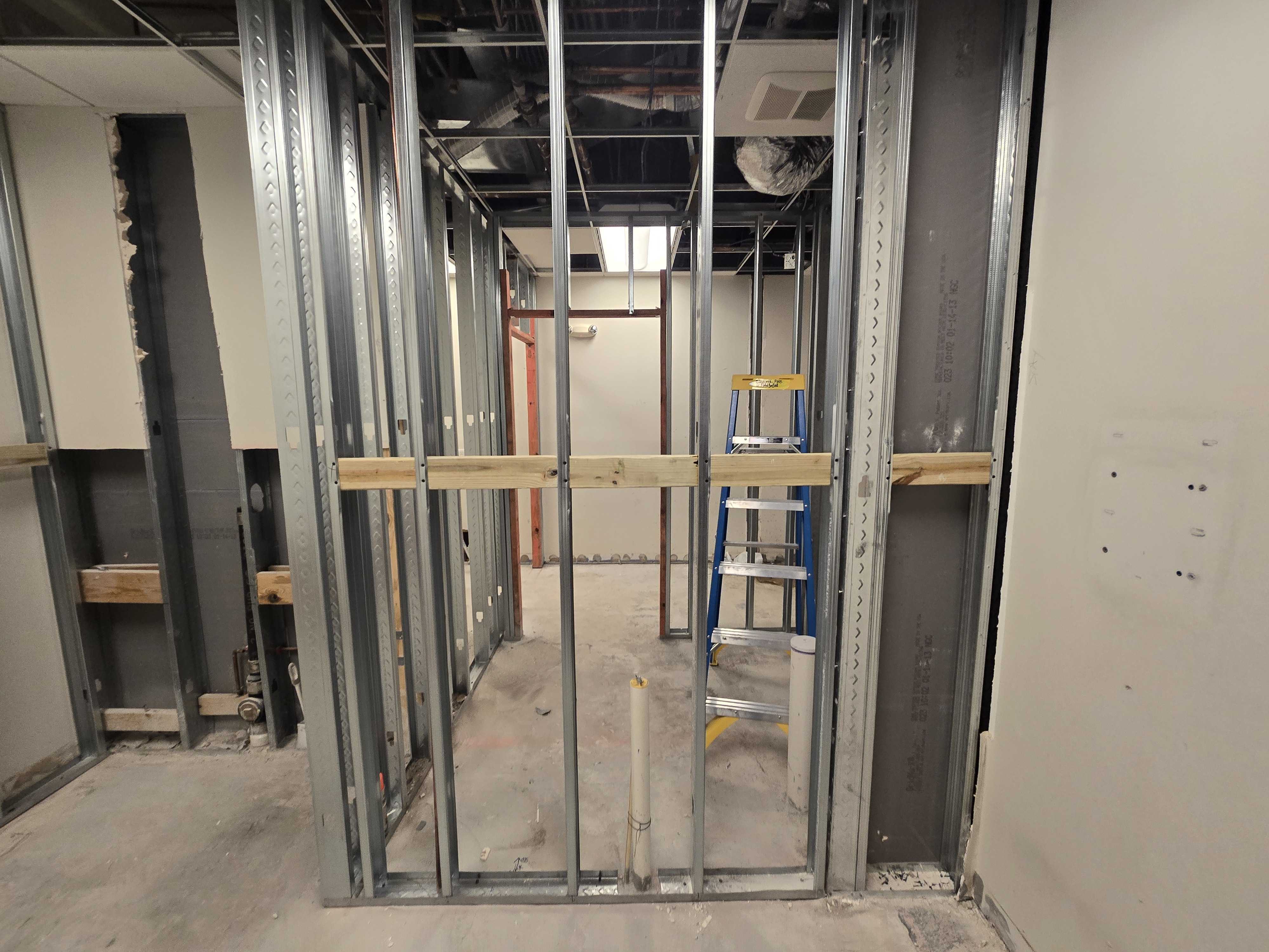Studio buildout — metal framing in progress